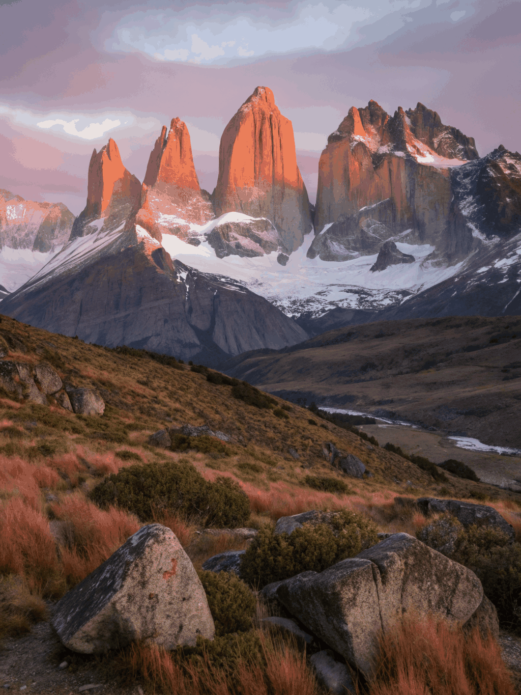 Dawn light hitting granite spires in Patagonia